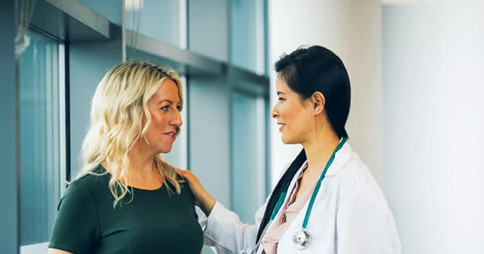 Female doctor with female patient
