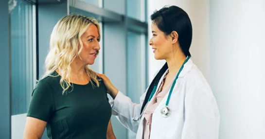Female doctor with female patient