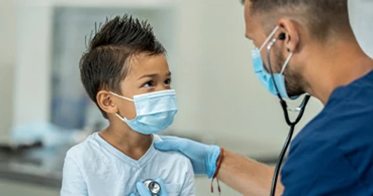 male-doctor-with-male-child-patient-with-face-masks