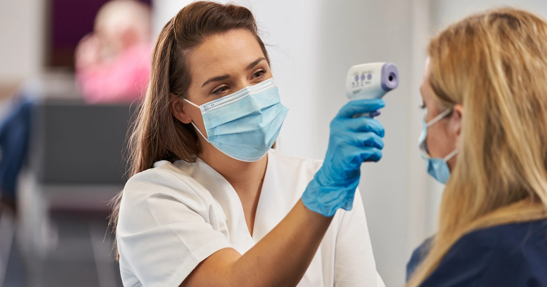 Nurse with temp gun_3 Nurse with temp gun_3