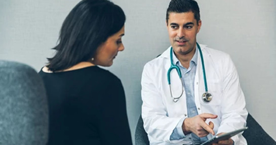 smiling-male-doctor-with-patient