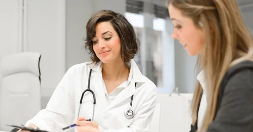 Two-female-doctors-reviewing-notes